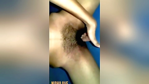 Indian hottie in a sexy outfit sucks her hairy pussy