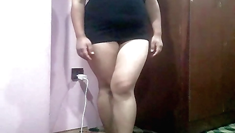 Skinny girl with a nice round ass is masturbating in a studio