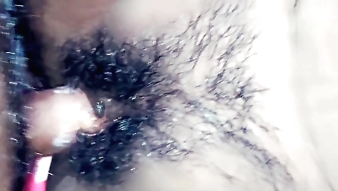 Indian hottie with fat bush plays dildo on a chair