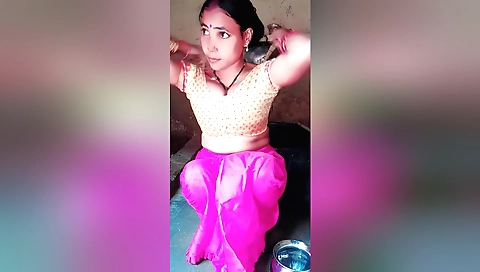 Sexy brunette in pink bikini takes bath in a solo video