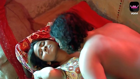 Sexy brunette in sexy outfit in bed and on her back