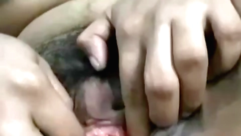 A horny brunette masturbates in front of the webcam