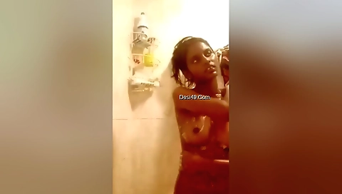 Busty tamil chick gets naked in the bathroom and masturbates