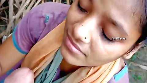 Indian woman takes a facial in a hot outdoor scene