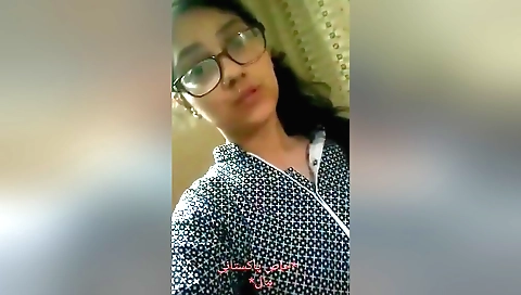 Beautiful brunette naked on the bed with small tits