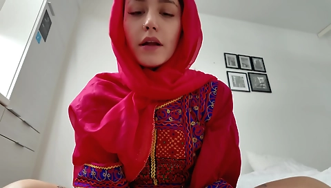 Indian brunette girl in a sexy dress and a long skirt