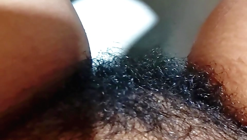 Hairy Indian woman in red lingerie rubs pussy with water