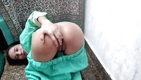 Indian girl in a colorful dress is horny and horny