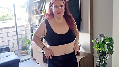 Gorgeous sexy red-head takes off clothes in stockings