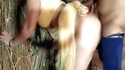 Sexy brunette strips naked on bed and stretches her pussy