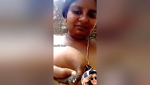 Amateur brunette enjoys outdoor masturbation in the shower