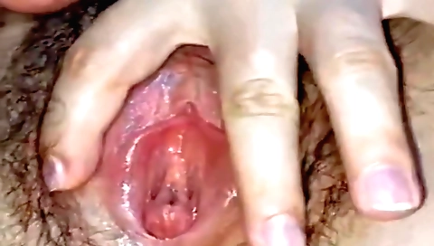 Beautiful girl enjoys masturbation with her hairy pussy