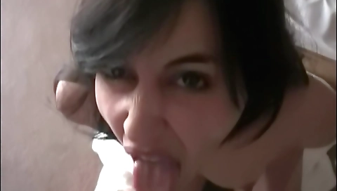 Busty brunette with small tits sucks cock in a hotel room