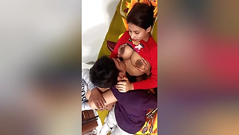 Indian women in black dresses have their throats licked