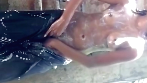 Indian bath video with a brunette soaking in the sun